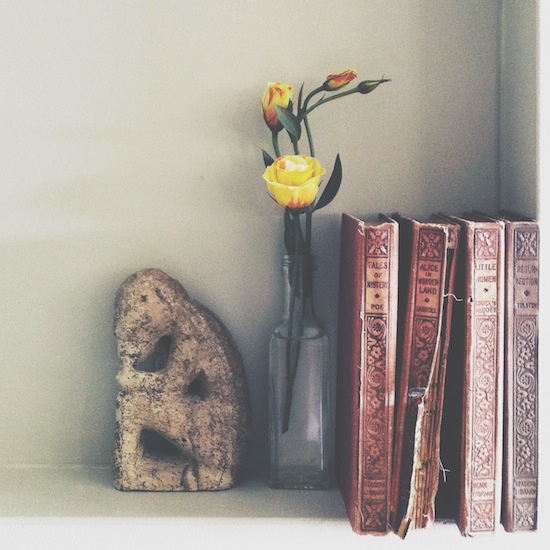 yellow-rose-with-vintage-books-statue